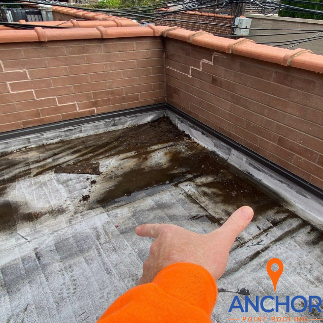 Got Ponding Water on Your Flat Roof in Chicago? Here's How We Alleviate It